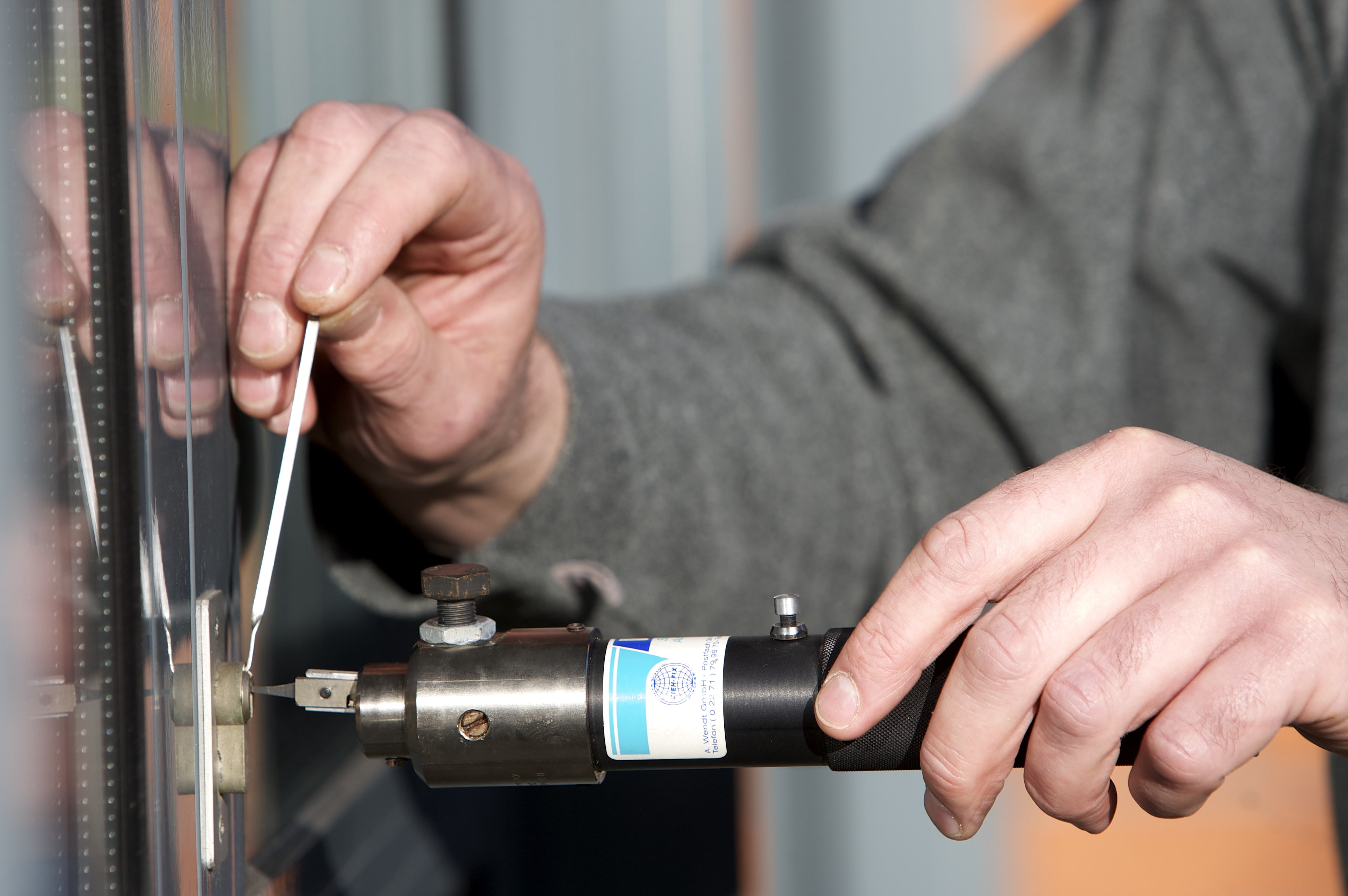 a locksmith repairing a lock